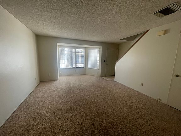 Front room facing front door and front window.