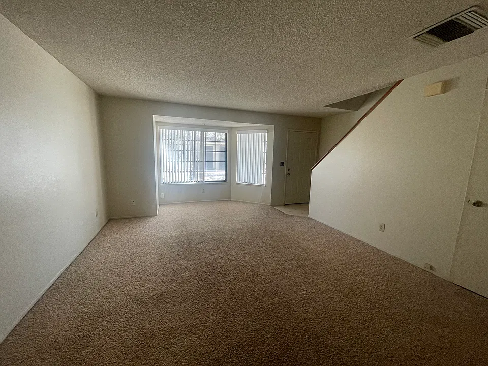 Front room facing front door and front window.