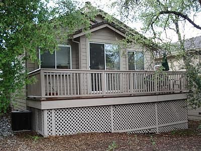 This is the view of the deck side, with a slider coming out from the kitchen.