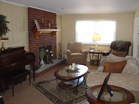 Living room w/ fireplace and mantle