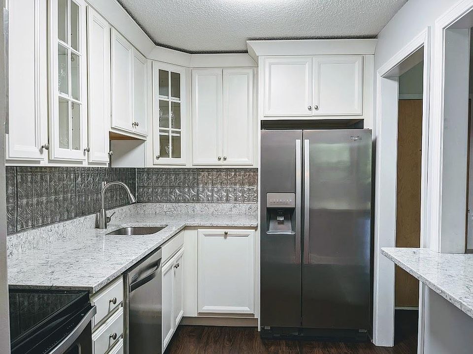 Granite, stainless, custom cabinets, and breakfast bar,