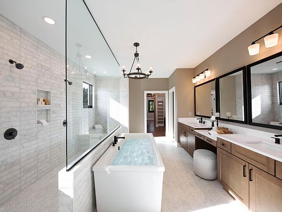 Spa primary bath with seamless walkthrough shower