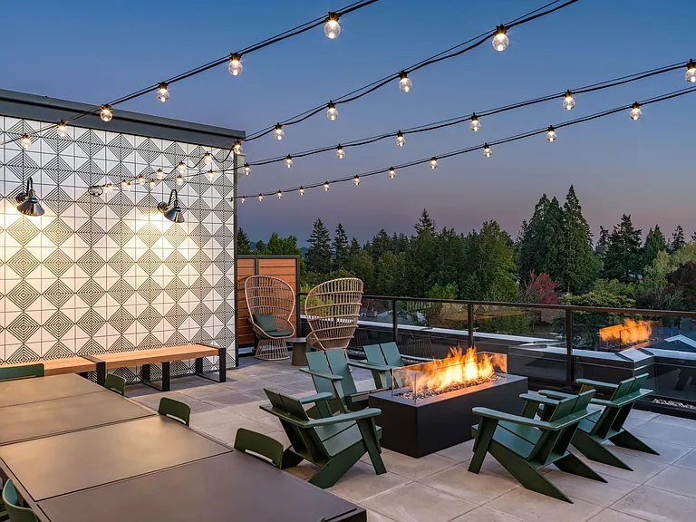 Cozy up at Modera Woodstock's outdoor terrace, complete with a welcoming firepit for year-round gatherings.