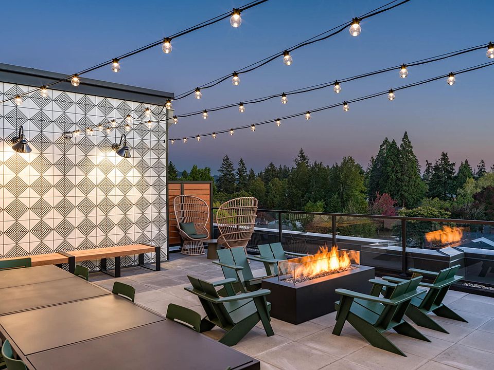 Cozy up at Modera Woodstock's outdoor terrace, complete with a welcoming firepit for year-round gatherings.