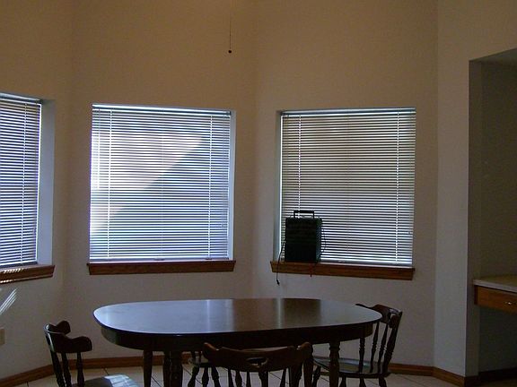 Large breakfast room with vaulted ceiling and computer desk