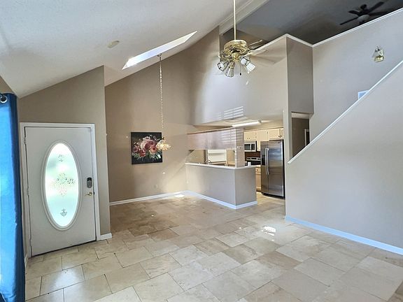 Dining room with breakfast bar and kitchen