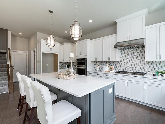 Gourmet kitchen features a large island