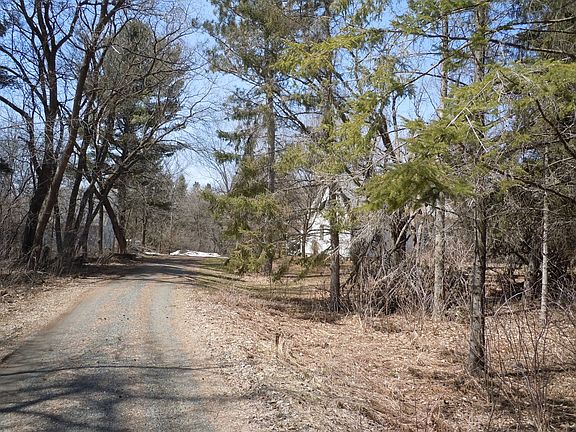 House is tucked back 