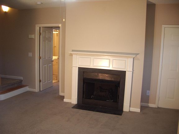 Great Room with Gas Fireplace & Ceiling Fan.
