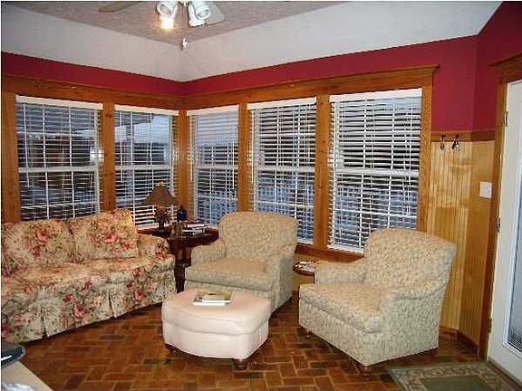 Family room of the kitchen looks out onto the patio and inground pool