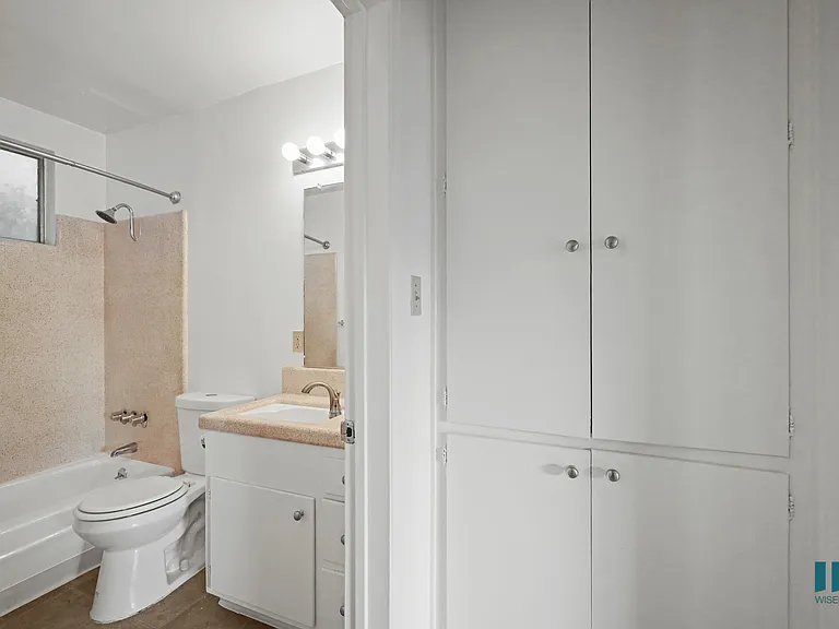 Hall Cabinets and Bathroom with a Shower-Bath and Vanity Cabinet Storage