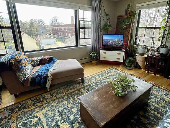 A plant lover's delight! The southeast facing living room features a huge picture window providing tons of natural light.