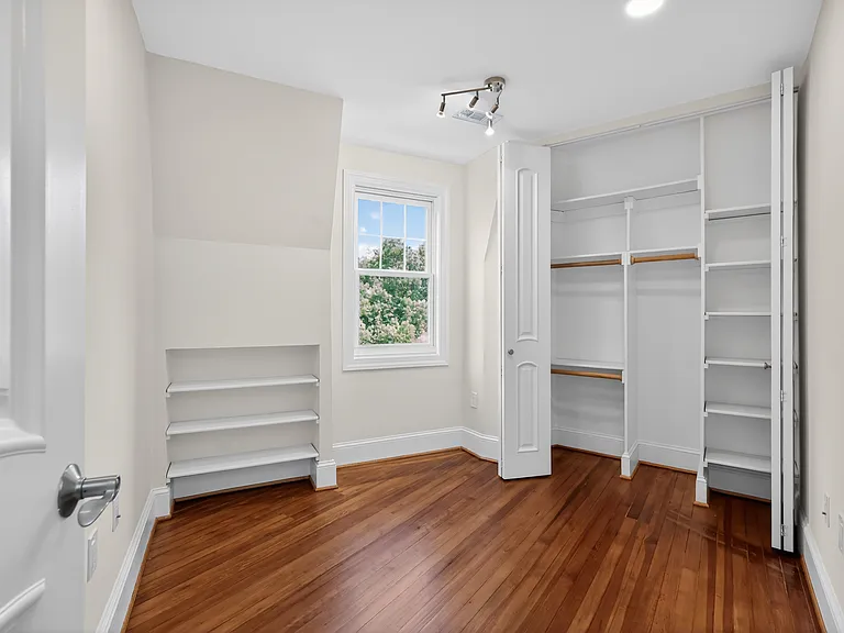 Bedroom 4 with integrated shelving.