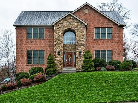 Beautifully landscaped lot!  This residence offers four bedrooms and 3.5 baths.  Notice the impressive stone work and new front 