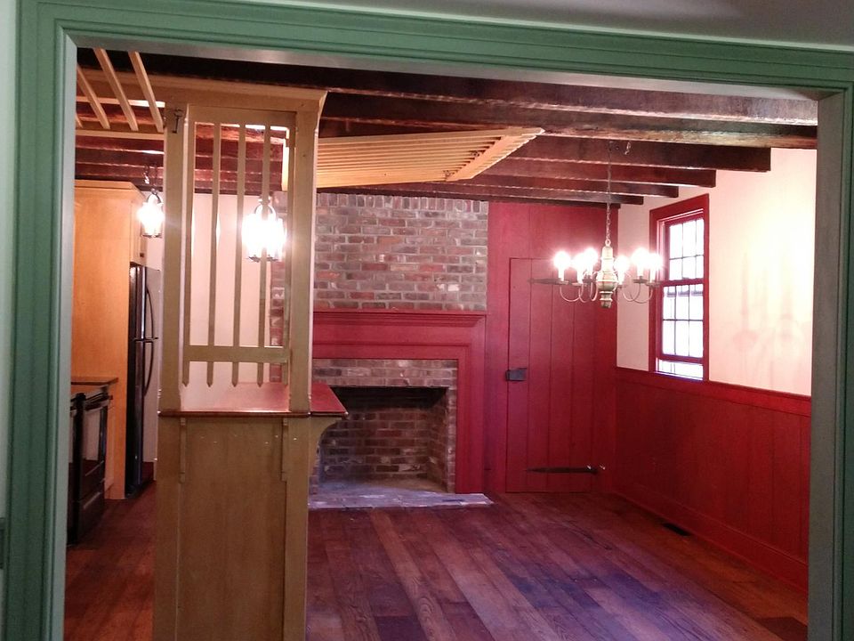 Kitchen with tavern style cage bar and fireplace
