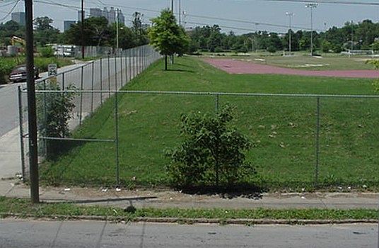 The city park and running track are directly across the stre