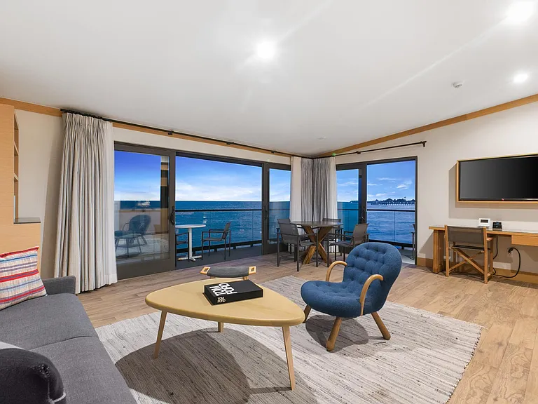 Have a glass of wine and watch the sunset from the comfort of your suite