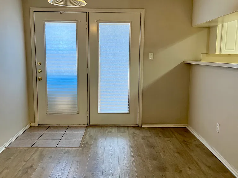 French door leads out to a small patio, expanding your entertainment space. Plenty of eating spaces, including bar height bar and full size dinning area.