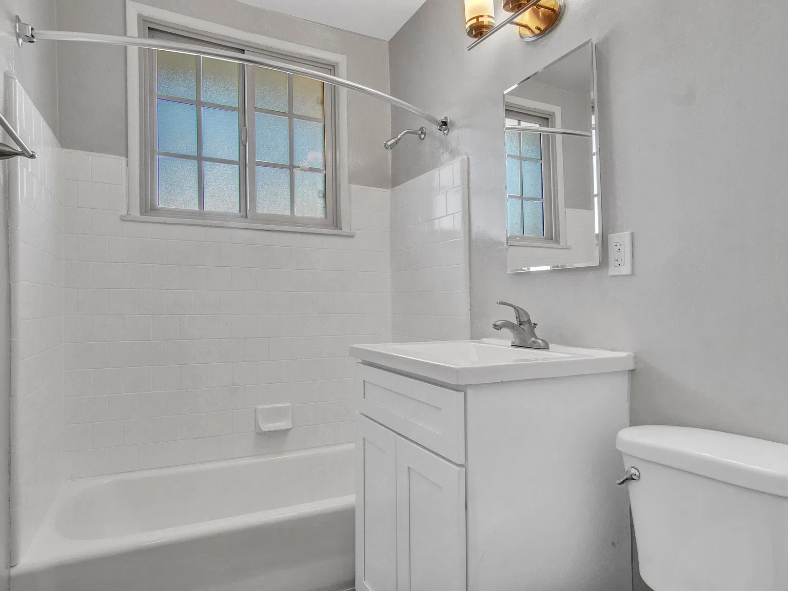 Representative renovated studio in the building; finishes and appliances vary by unit.