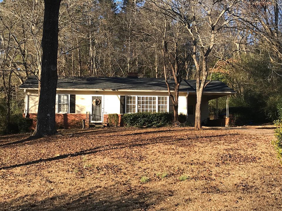 Adorable ranch home in historic Roswell set way back from the street on a level lot.