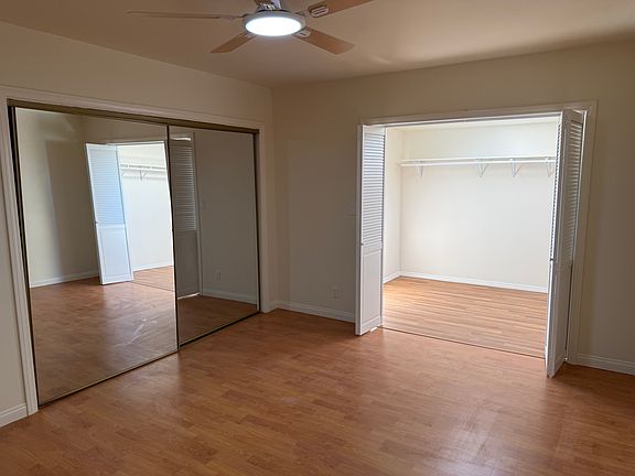 Master bedroom with walk-in closet and large sliding closet