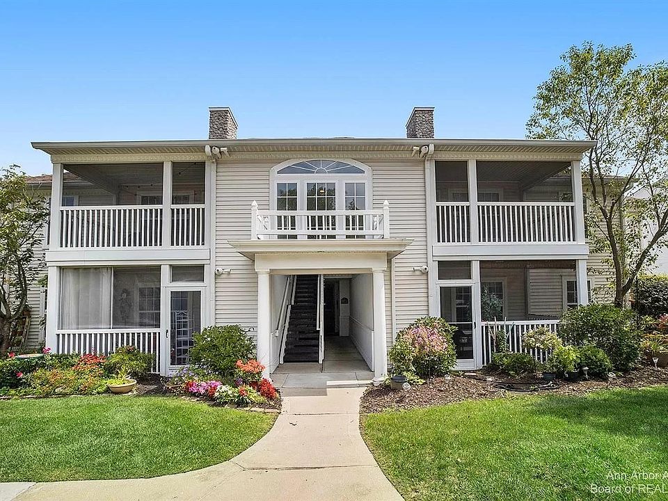 Front of building - steps from parking and private one car garage. 1st floor unit bottom left.