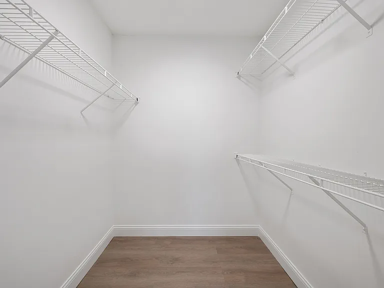 Maximize your storage with this stylish and roomy walk-in closet. Maximize your storage with this stylish and roomy walk-in closet.