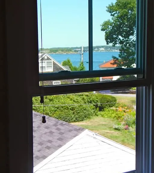 The views from one of the windows in the master bedroom can be seen from the bed. Willard Beach makes an appearance in the winter time (thru the trees) from the other window, next to the bed.