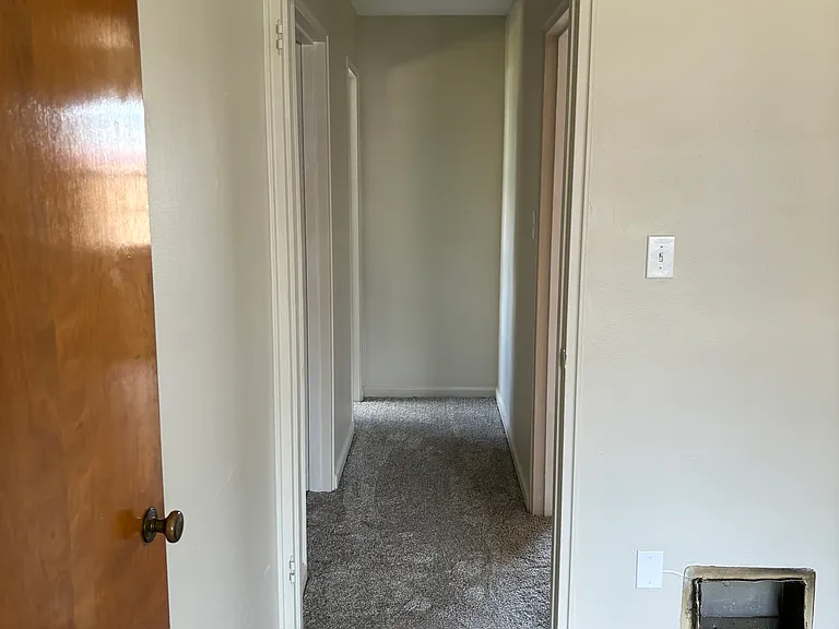 Hallway from living space to kitchen and bath.