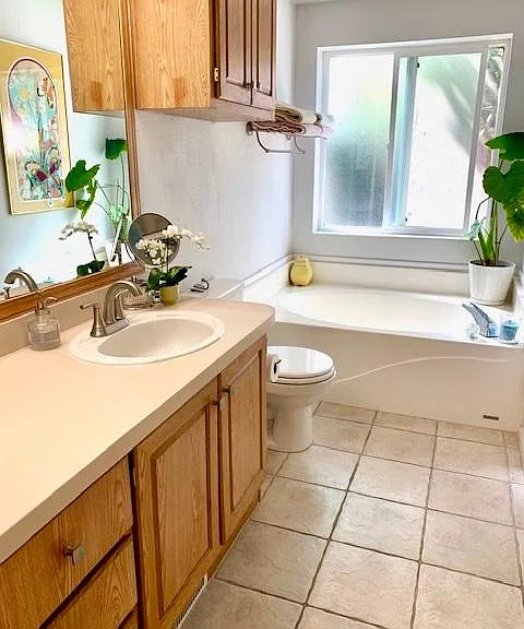 large bathroom with soaking tub and separate shower