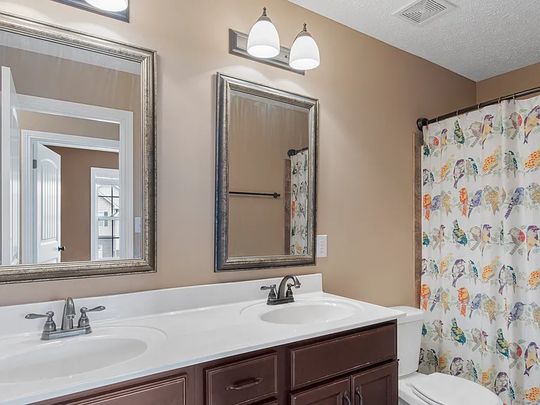 Full bath with double vanity and lots of under-vanity storage