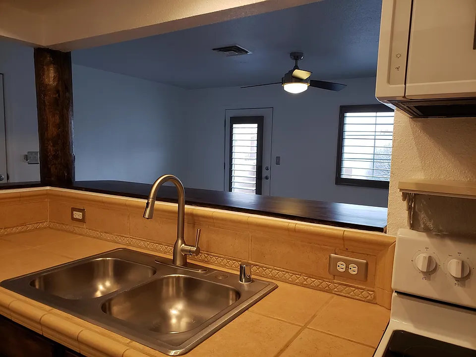 Wooden bar area makes for great entertaining or company while cooking.