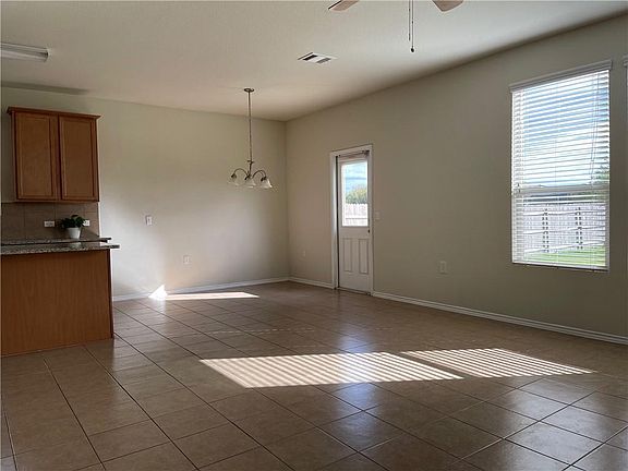 Large, open living area has easy-to-clean tile floor