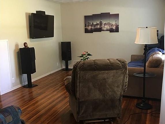 Living room area is spacious and has tons of natural light with not one, but two windows!