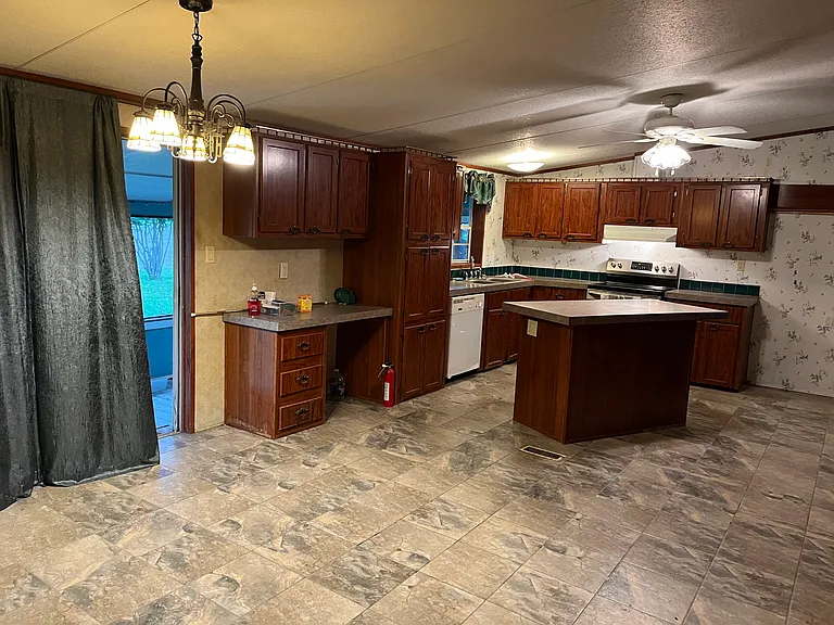 The view from the dining area and the entrance into the back living room and the exit out to the mud room!