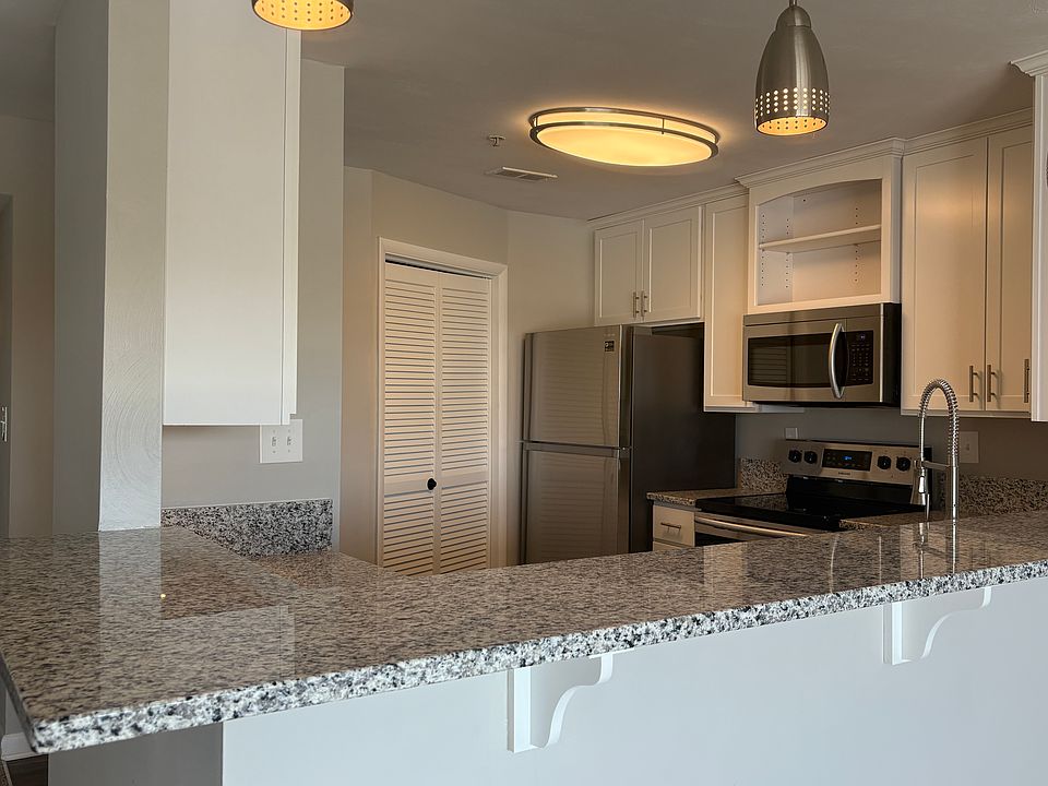 Open kitchen with wrap around breakfast bar