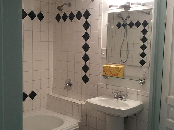 Large tiled bathroom with tub/shower