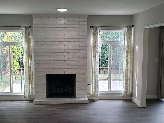 Living room opens to the dining room, kitchen and family room on the right.