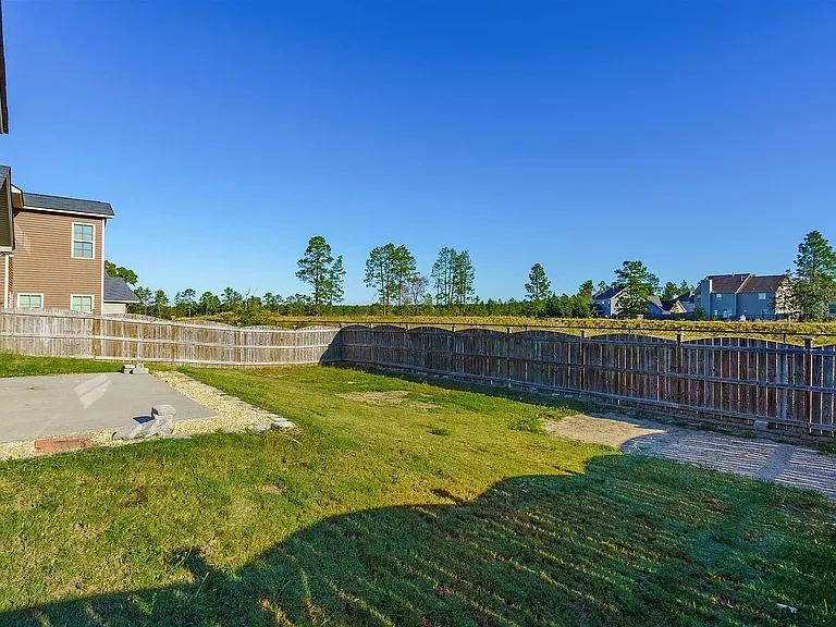 Large lot with beautiful, peaceful open space behind the fence.