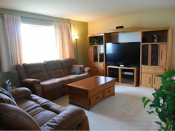 Living room that over looks the kitchen/dining area.