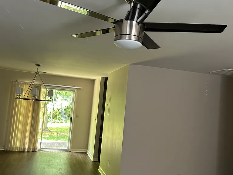 Dining Room/Den with view to Backyard. New Ceiling Fan.