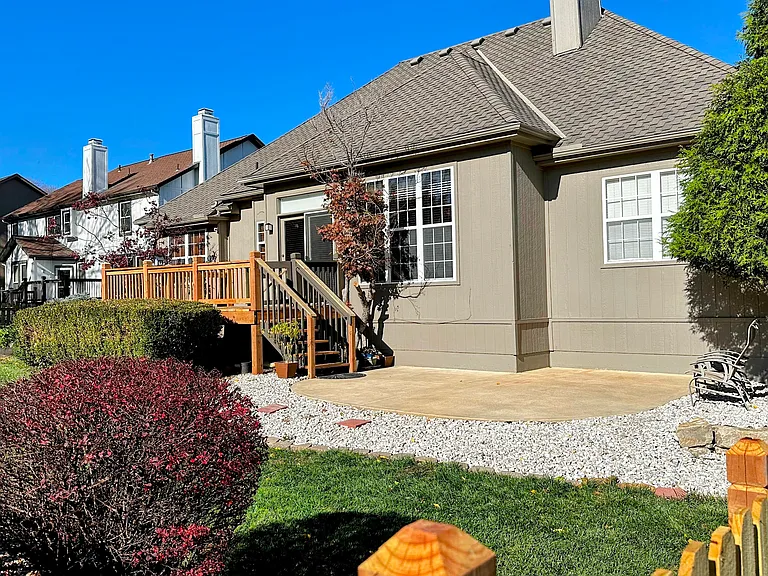 Fully fenced backyard with rennovated deck.