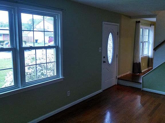 Front Entrance open to Living Room on left and Family Room t