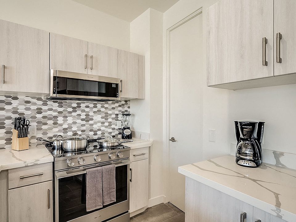 Built-in microwave, tall tub dishwasher and electric range