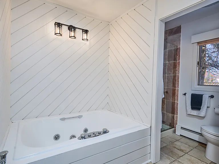 Fist Floor primary bath with hot tub and stall shower