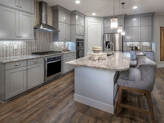 The Gardengate kitchen provides an impressive design with built-in cabinets, designer lighting and t