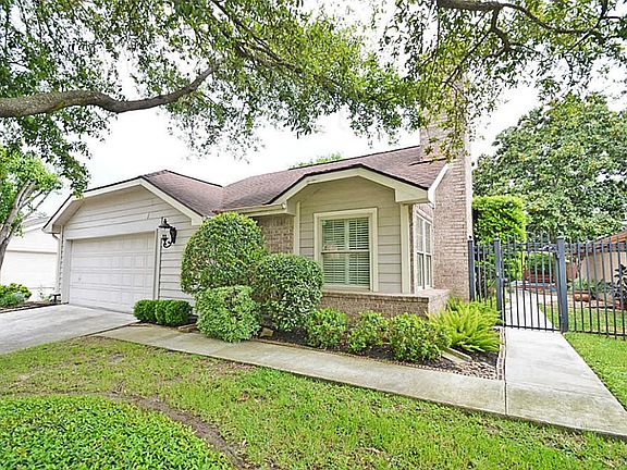 WOW LOOK AT TREES AND LANDSCAPE. ALSO CUSTOM ROD IRON FENCE "WITH PRIVATE ENTRY.