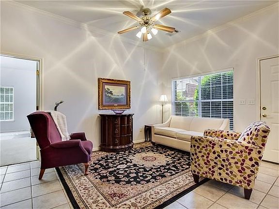 The living area includes a "nook" for the television and is adjacent to the master bedroom.