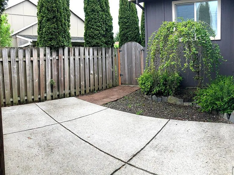 fenced-in backyard patio