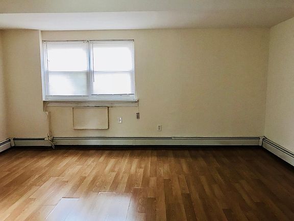 Another view of large living room with large window